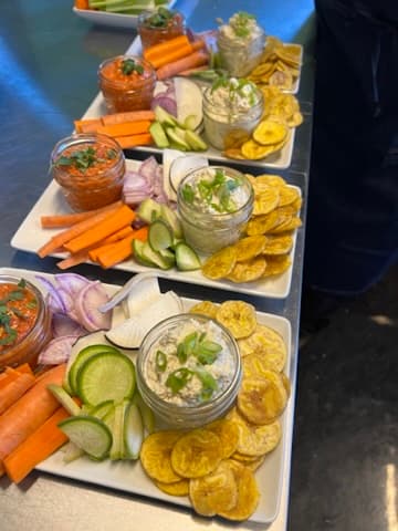 House-made dips with fresh vegetables and plantain chips